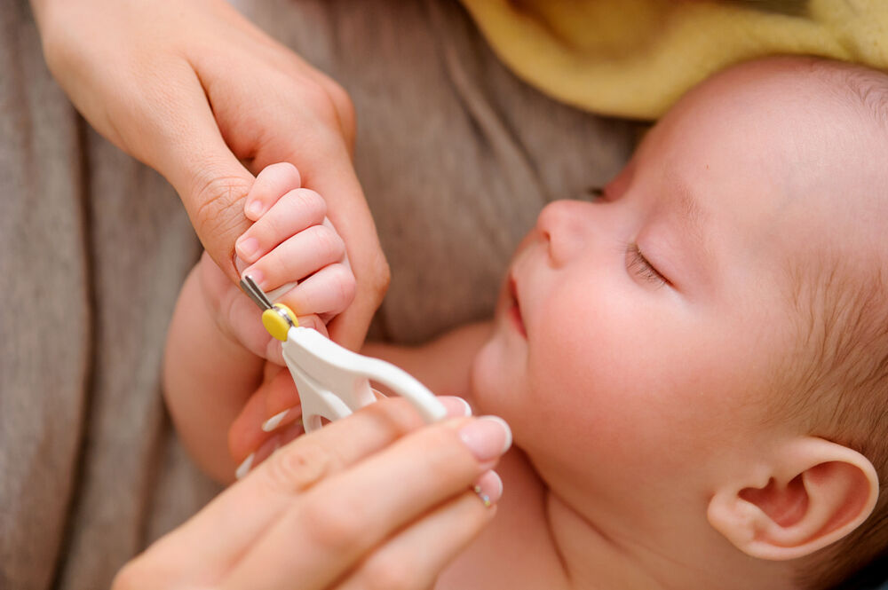 Trimming infant deals fingernails